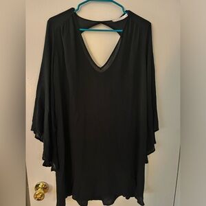 Loose flowy black mini dress with long bell sleeves from Lush
